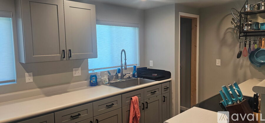 A kitchen with a sink and cabinets.