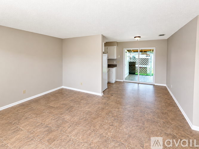 A room with beige walls and floor tiles is available for rent.