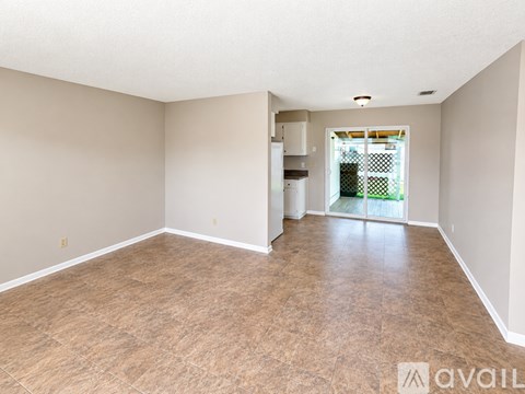 A room with beige walls and floor tiles is available for rent.