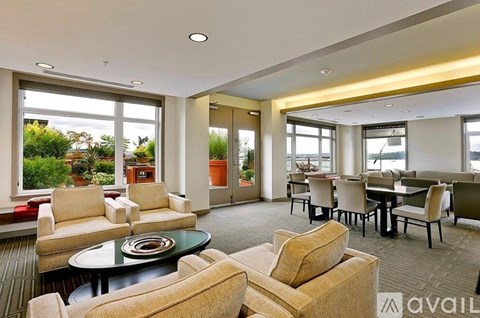 A living room with a glass table and chairs.