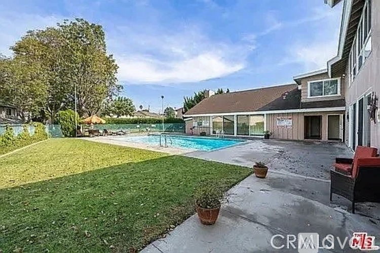 A house with a pool in the backyard.