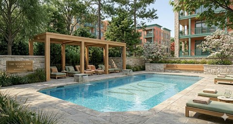 A pool surrounded by lounge chairs and a wooden pergola.