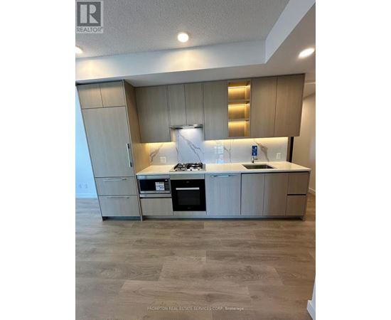 A kitchen with a stove top oven and a microwave.