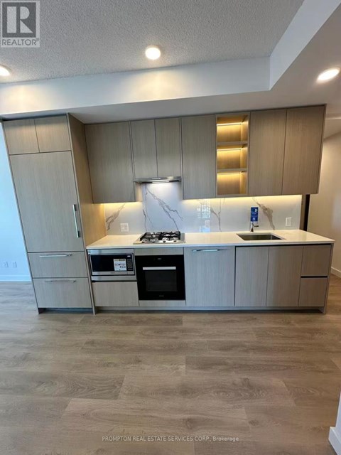 A kitchen with a stove top oven and a microwave.
