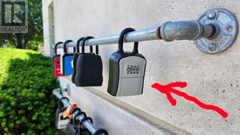 A row of padlocks are attached to a metal rod.