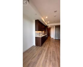 A kitchen with wooden cabinets and a countertop.