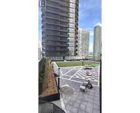 A rooftop with a chess board and chairs.