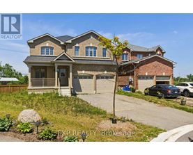 A large house with a carport and a garage is for sale.