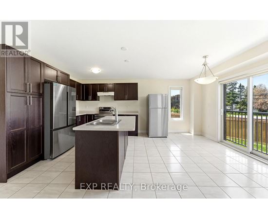 A kitchen with dark brown cabinets and a white countertop.