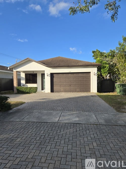A house with a driveway in front of it.