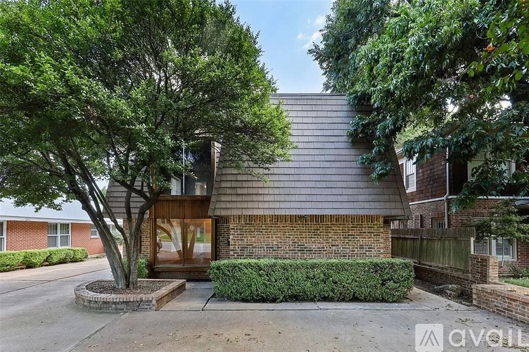 A house with a tree in front and a sign that says "available".