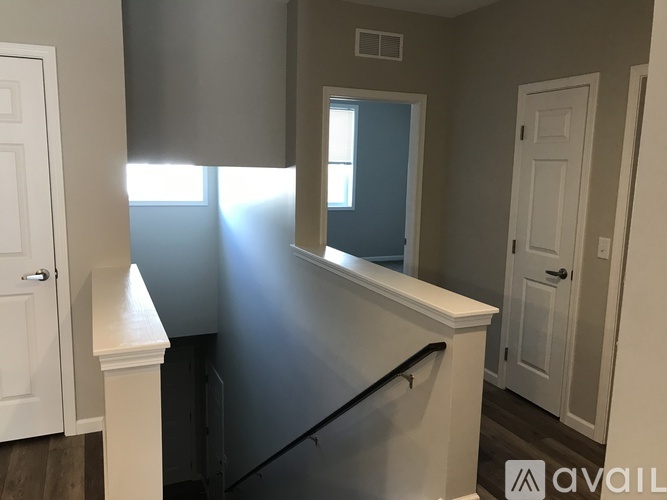 A room with a window and a door.