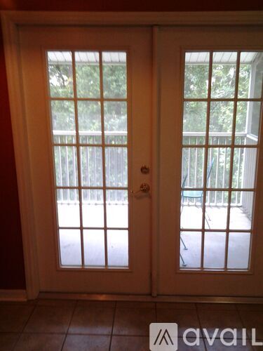 A double door with a glass window and a wooden frame.