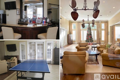 A living room with a pool table and a Christmas tree.