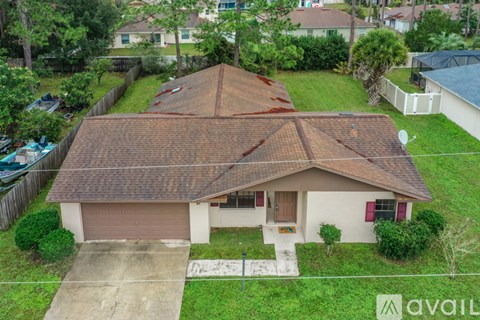 A house with a brown roof and a brown garage door.