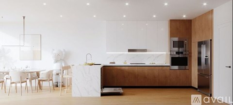 A modern kitchen with wooden cabinets and stainless steel appliances.
