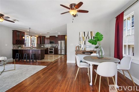 A living room with a white couch and a coffee table.