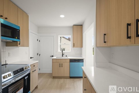 A kitchen with wooden cabinets and a white countertop.