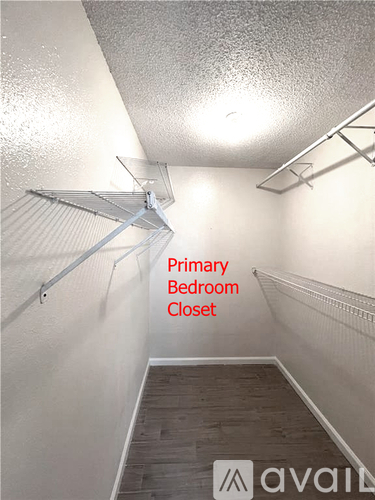 A long hallway with a Primary Bedroom Closet.