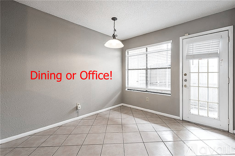 A room with a choice of being used as a dining or office space.