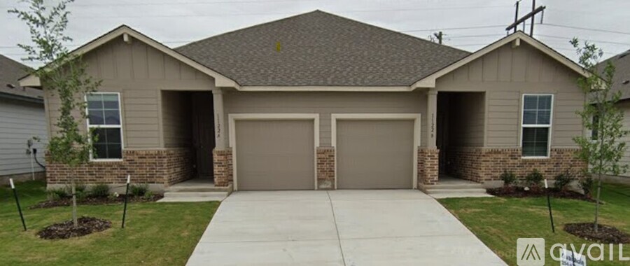 A house with a brown garage door and a driveway.