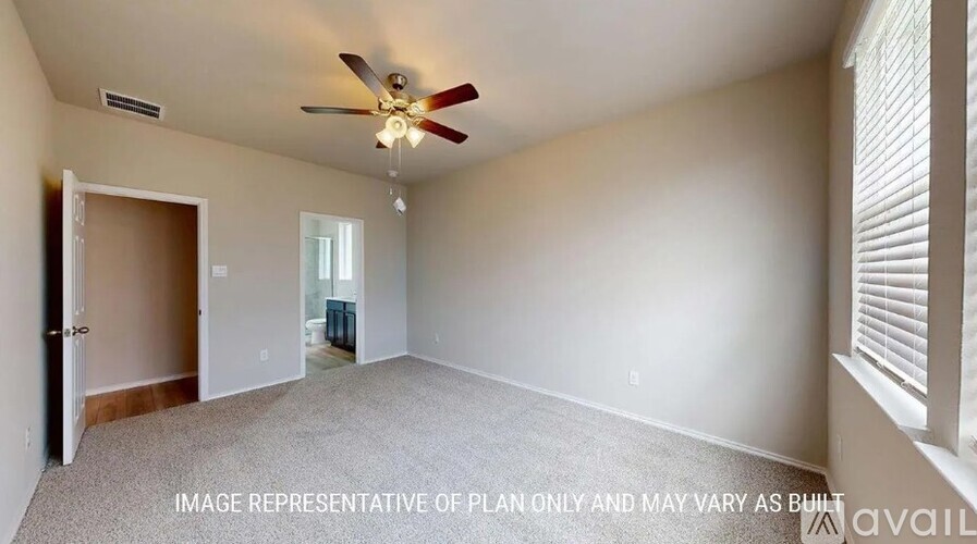 A room with a ceiling fan and a window with blinds.