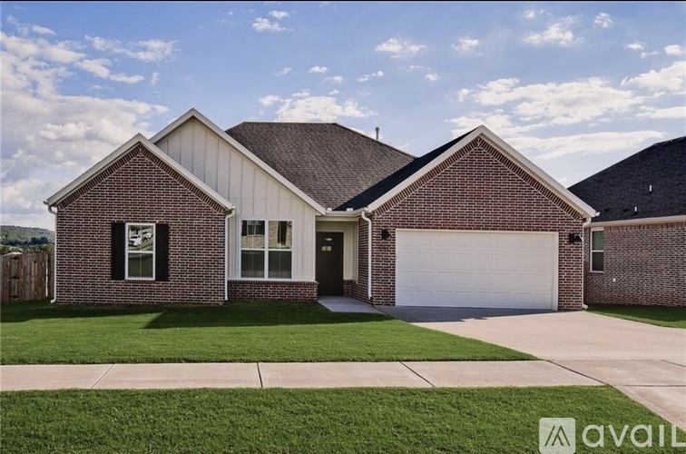 A house with a brick facade and a white garage door.