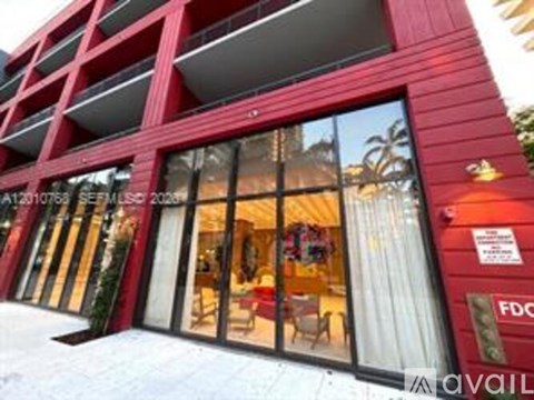 A red building with a sign that says "FDC" on it.