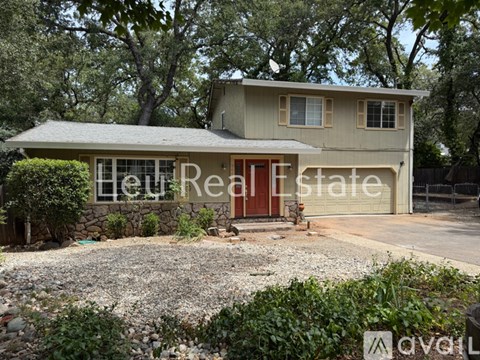 A house with a red door is for sale.