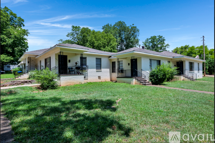 A house with a lawn in front of it is for sale.