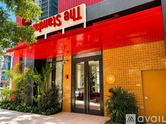 The entrance to a building with a red and yellow facade.