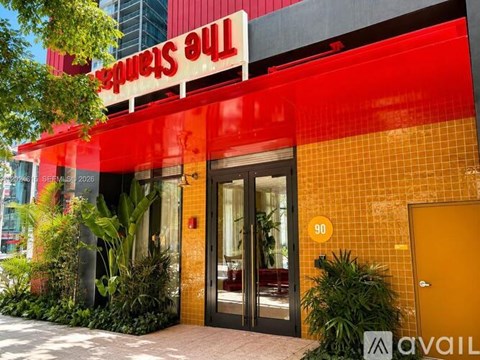 The entrance to a building with a red and yellow facade.