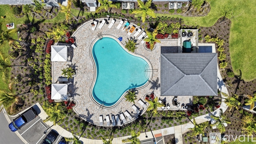 A large backyard with a pool and a house.