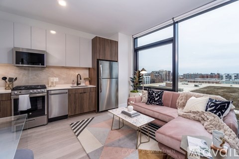 A modern kitchen with a view of the city.