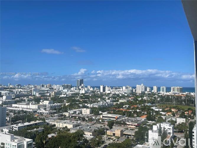 A cityscape with buildings and a clear sky.
