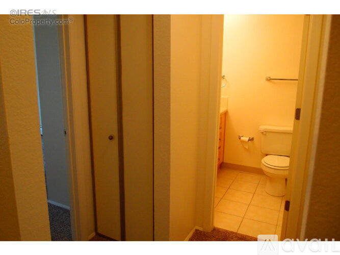 A bathroom with a toilet and a sink.