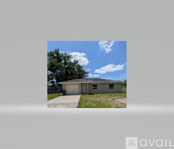 A house with a garage is available for sale.