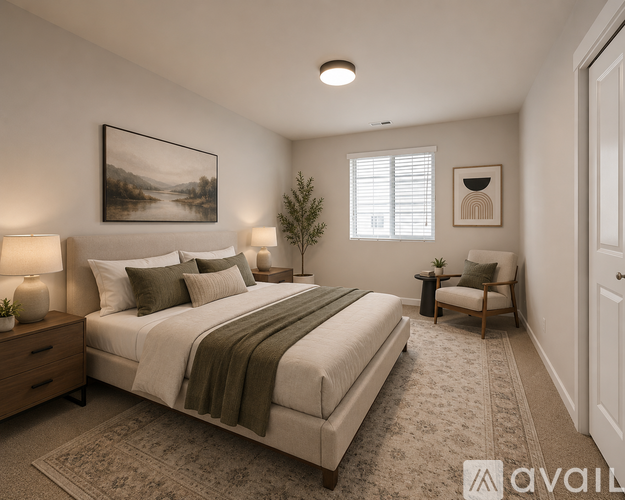 A bedroom with a large bed and a painting on the wall.