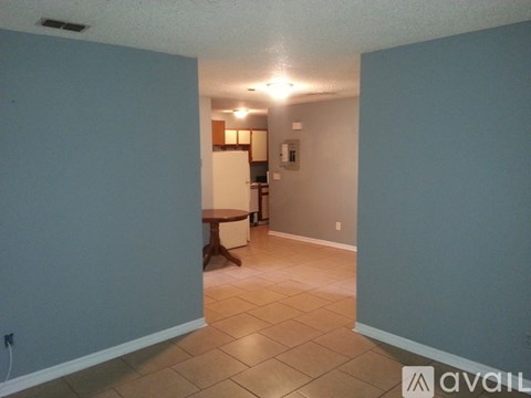 A room with a table and chairs in it.