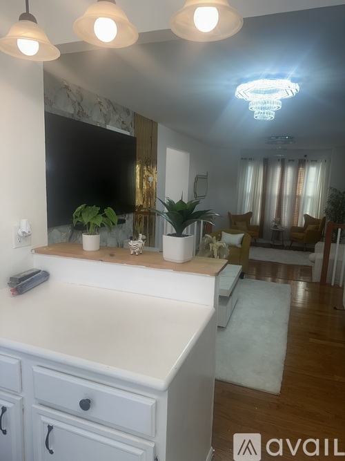 A bathroom with a vanity and a mirror.