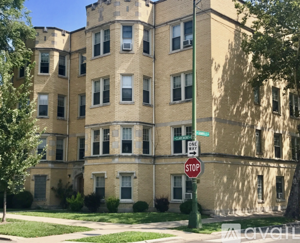 A tall building with a stop sign in front of it.