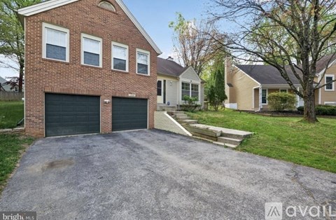 A house with a garage is available for sale.