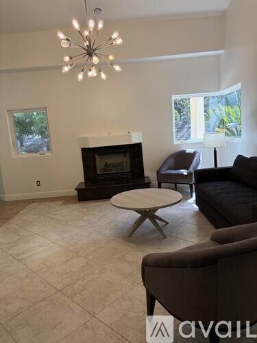 A living room with a fireplace and a couch.