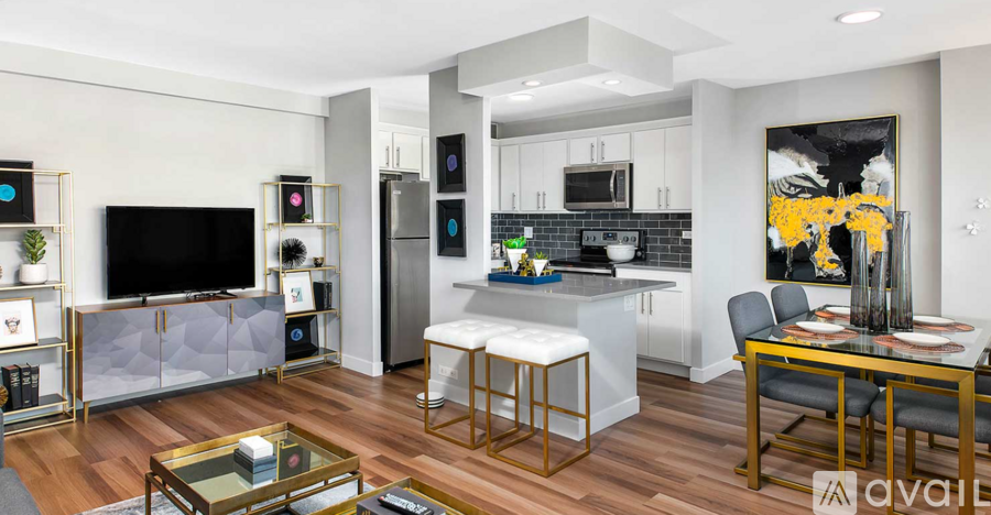 A modern kitchen with a dining table and chairs.