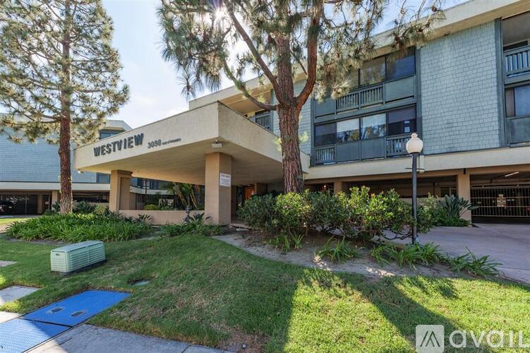 A Westview apartment complex with a grassy front yard.