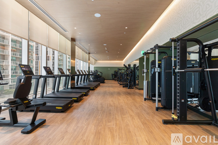 A gym with treadmills and other exercise equipment.