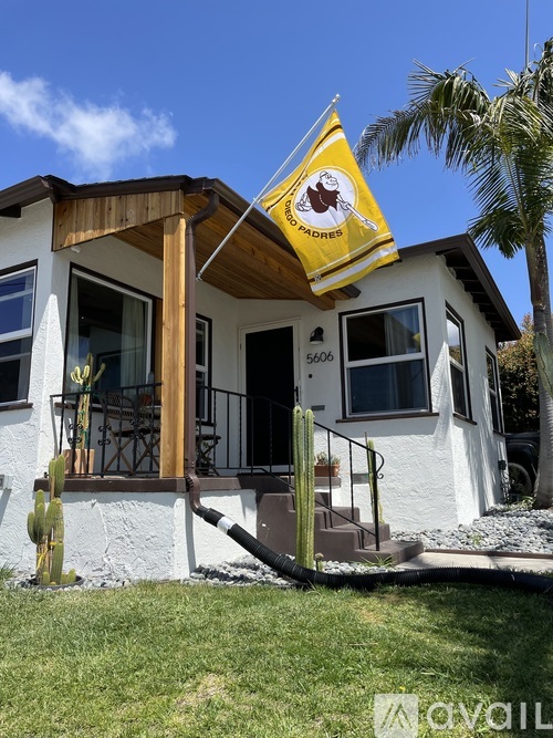 A house with a yellow sign on the front porch.