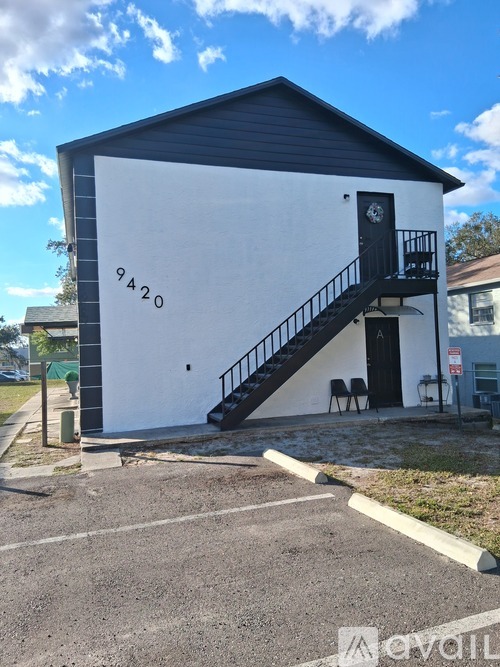 A small white building with the number 9420 on it.
