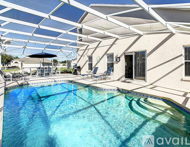A pool under a white canopy.