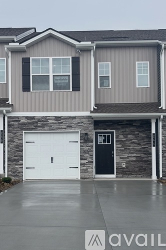 A house with a garage door that is closed.